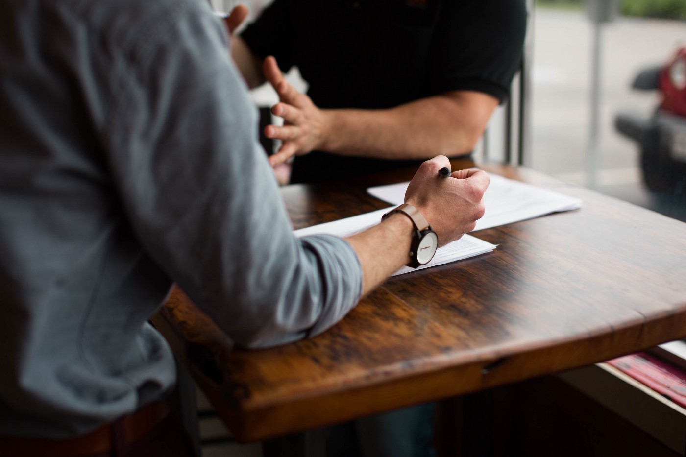 Two people sitting at a table.